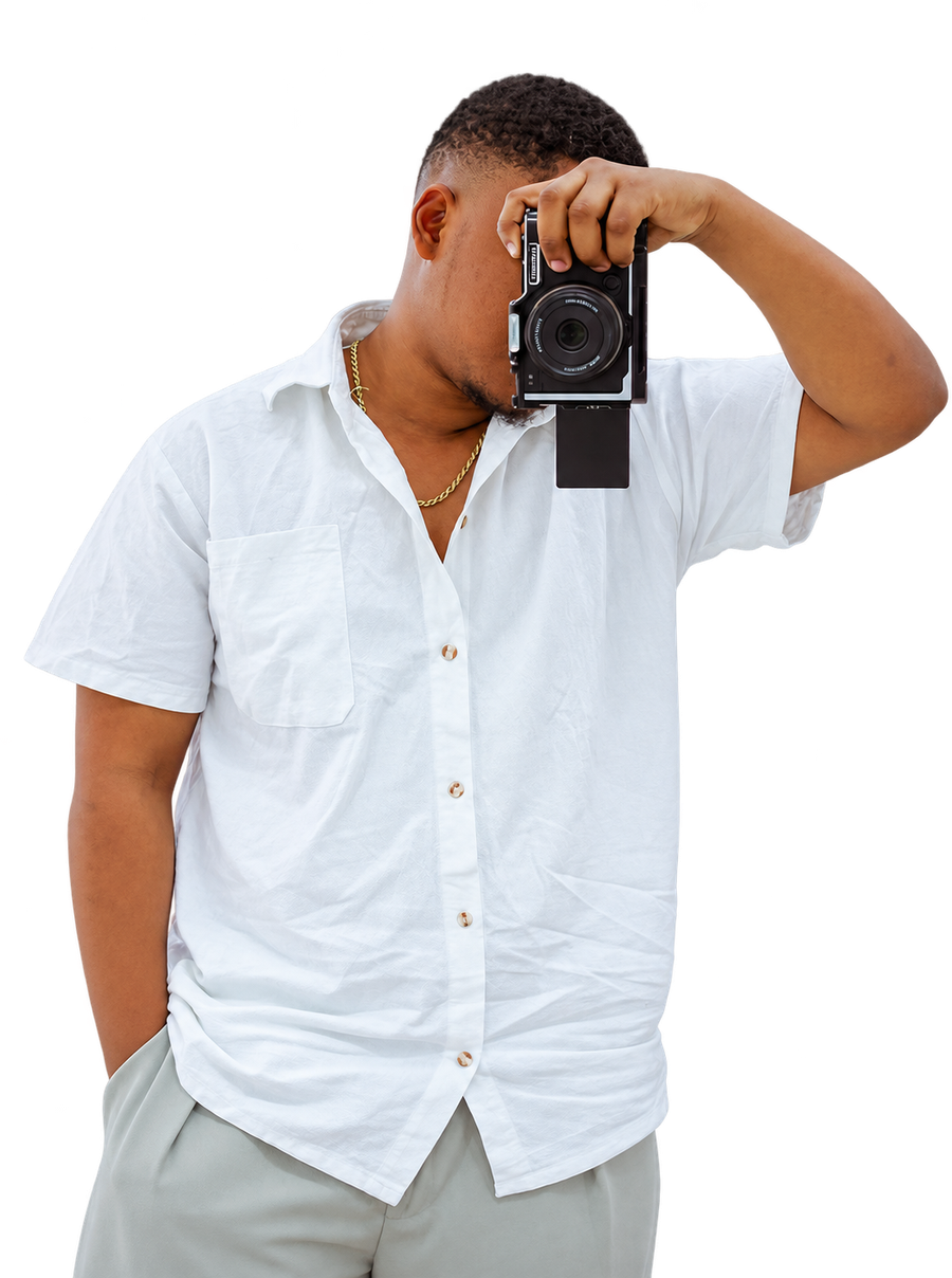 Prince Maro, founder of Off Kenny Digital Realm, raising a camera to his eye.
